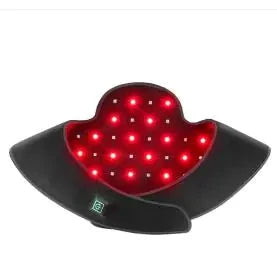 Black curved therapy pad with a heart-shaped red LED panel, flanked by wing-like sides.