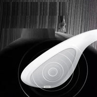Thumbnail for White curved handheld EMS facial lifting device with concentric circular target pattern on a dark textured background